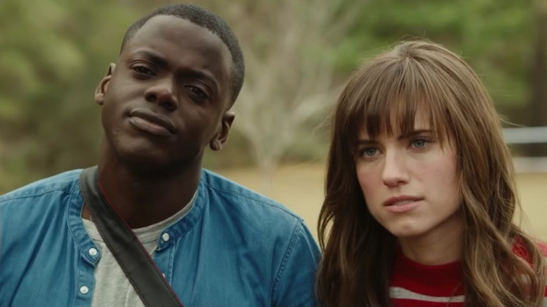 Chris and Rose staring confused in Get Out