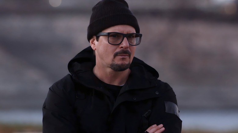 Zak Bagans looking serious arms folded