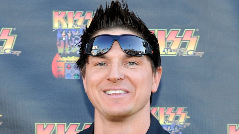 Zak Bagans smiling with spiked hair and sunglasses