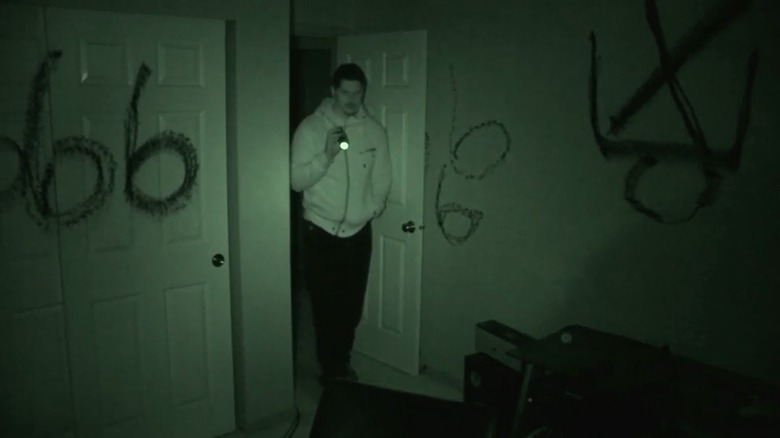 Ghost hunter entering demonic room