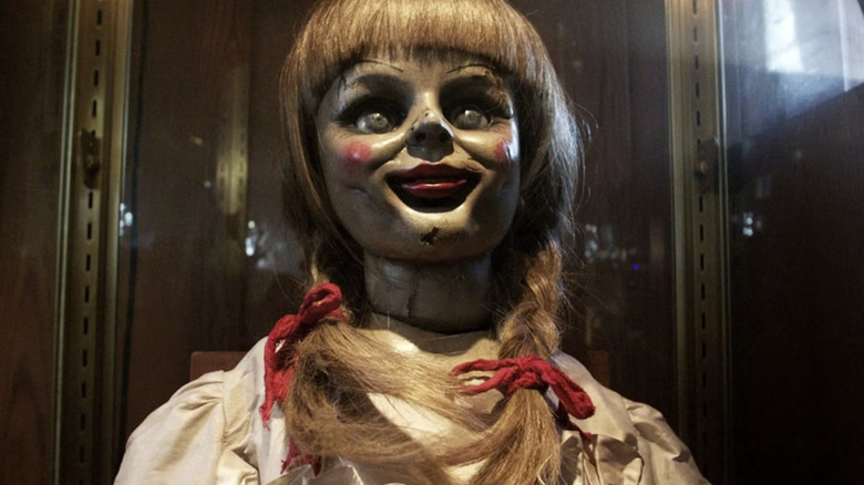 Annabelle grins hideously in "Annabelle Comes Home" (2019)