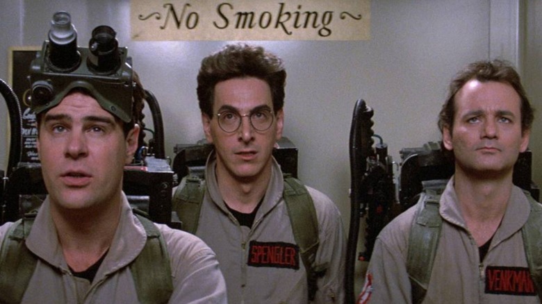 Ray Stantz, Egon Spengler, and Peter Venkman shoulder to shoulder