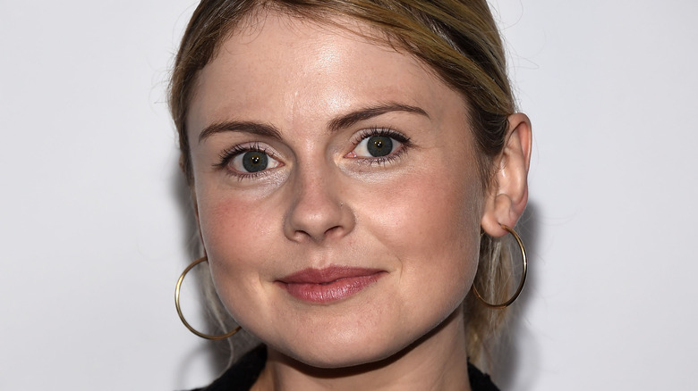 Rose McIver smiling in front of white background