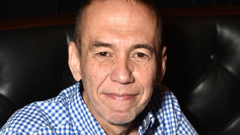 Gilbert Gottfried sitting down and smiling