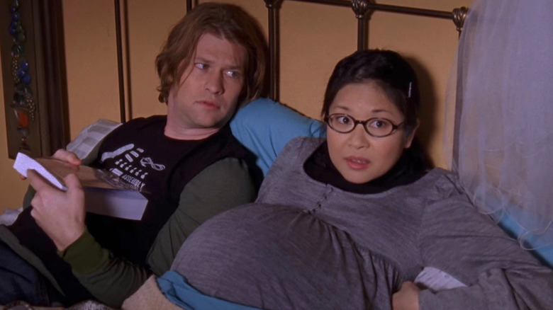 Pregnant Lane and Zack in bed