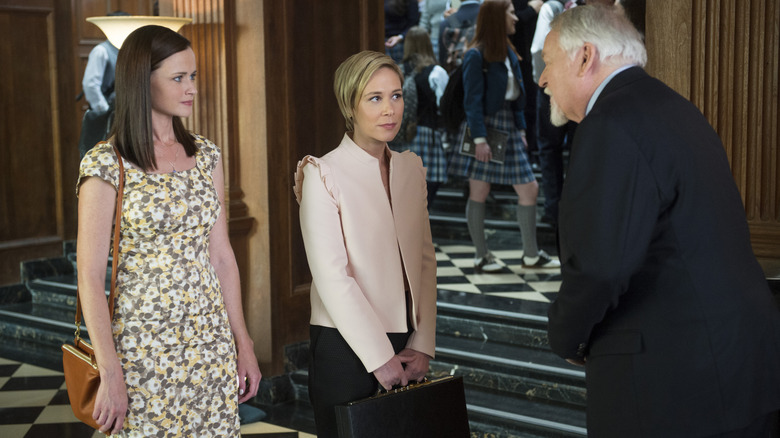 Paris and Rory stand near Headmaster Charleston