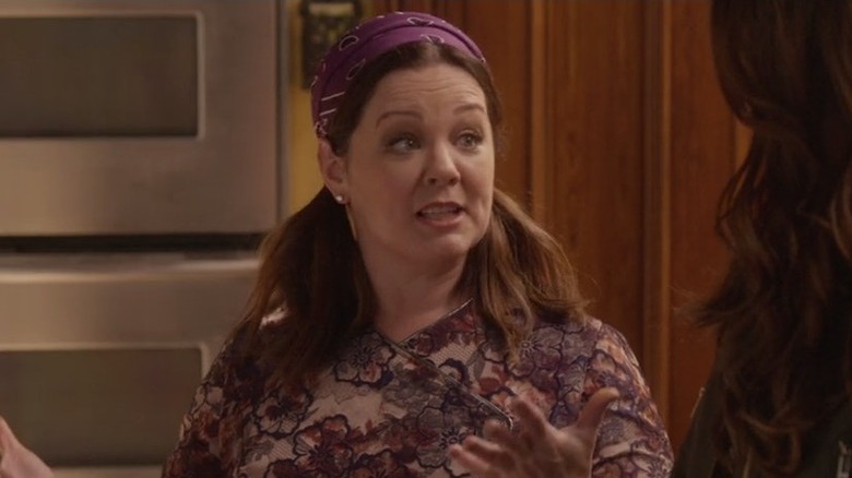 Sookie gesturing in kitchen