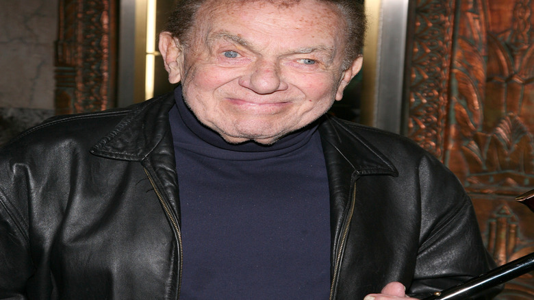 Jack Carter gives a slight smile