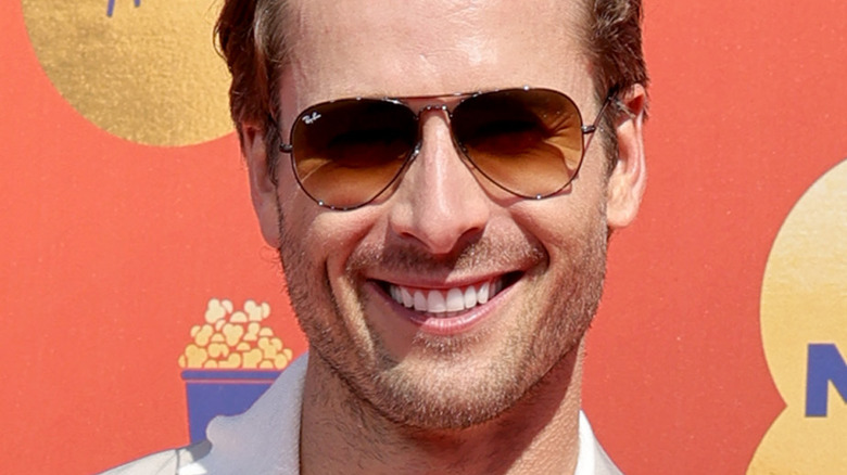 Glen Powell smiling