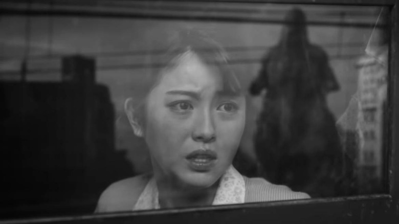 Noriko Ōishi looking at Godzilla