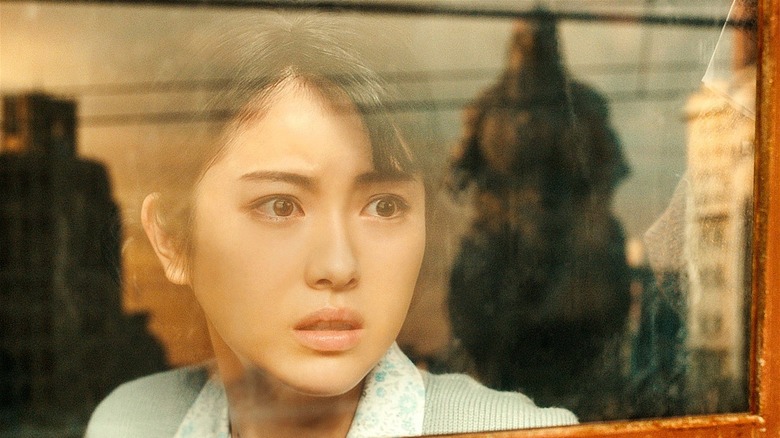 Noriko seeing Godzilla through window