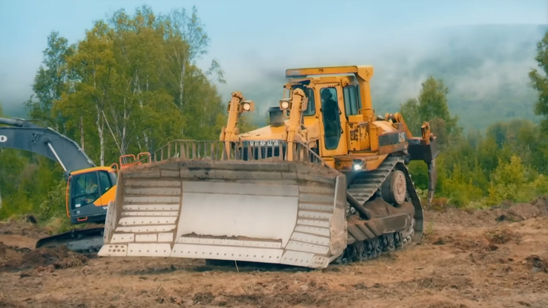 Gold Rush crew driving an excavator