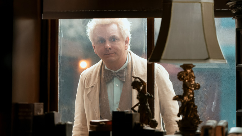 Aziraphale stands in the window of the bookshop in "Good Omens 3"