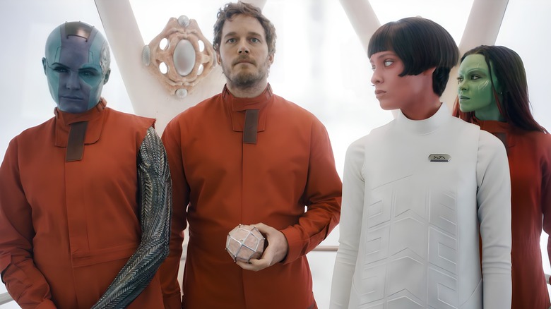 Guardians standing together orange jumpsuits