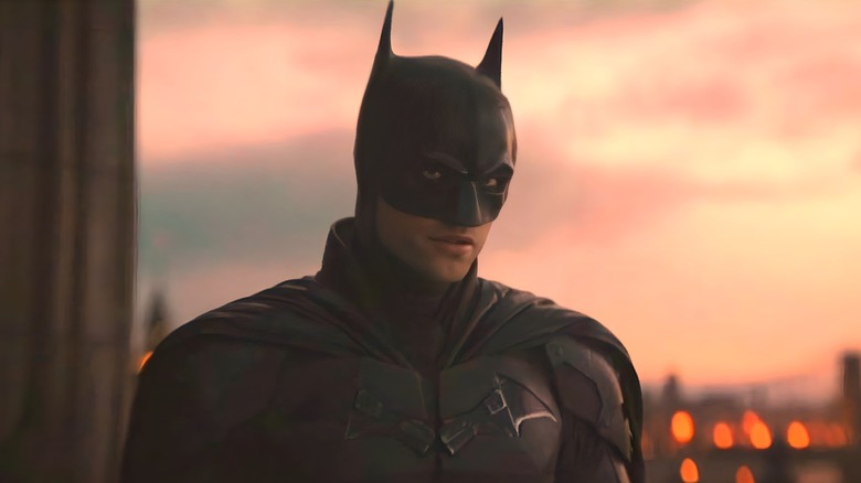 Batman standing on a roof