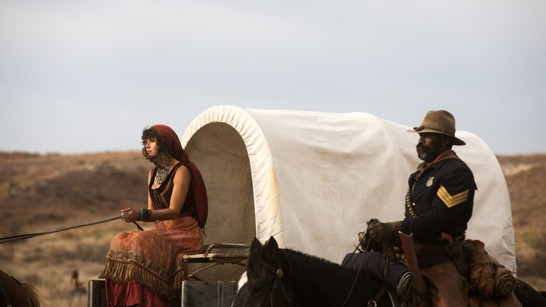 Noemi and Thomas riding in a wagon