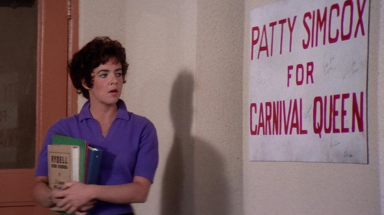 Rizzo standing in Rydell High