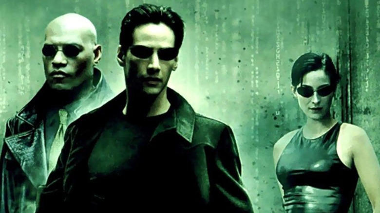 Keanu Reeves as Neo, Carrie-Anne Moss as Trinity, and Laurence Fishburne as Morpheus in The Matrix