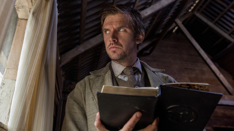 Thomas Richardson looking out of a window in Apostle (2018)