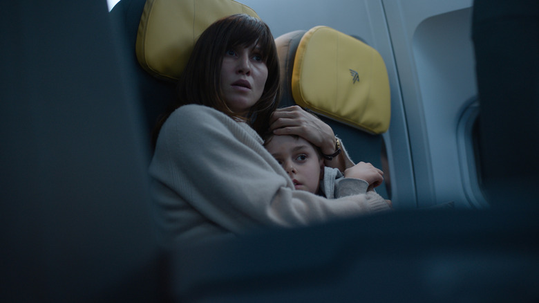 Nadia holding onto Elias in Blood Red Sky (2021)