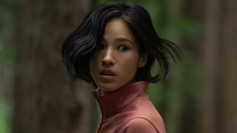 Iris looking over her shoulder in Don't Move (2024)