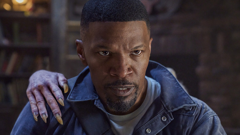 Bud Jablonski feeling a hand on his shoulder in Day Shift (2022)