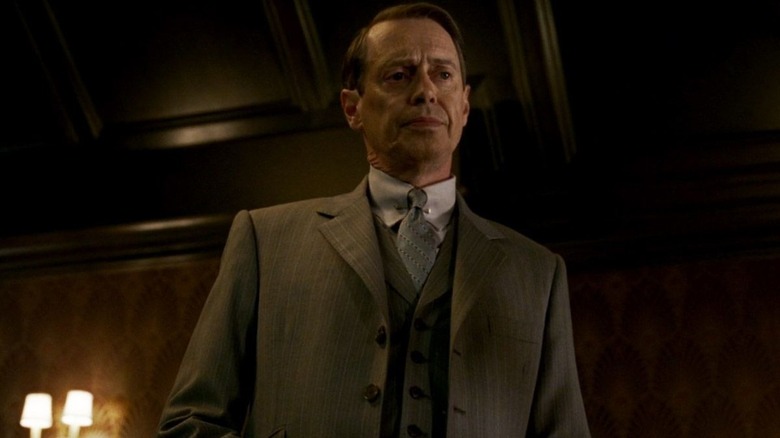 nucky holding a drink