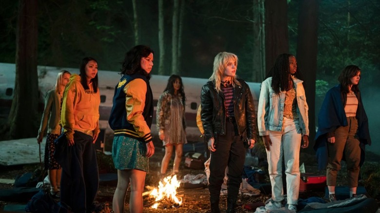 yellowjackets cast around a fire