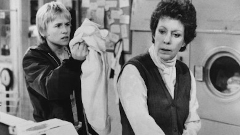 Amy Madigan stands near Carol Burnett