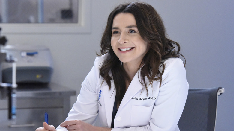 Dr. Amelia Shepherd smiling at desk