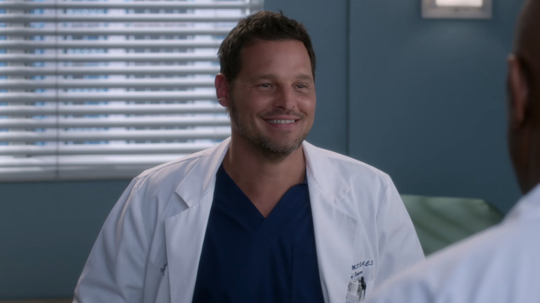 Alex Karev grinning