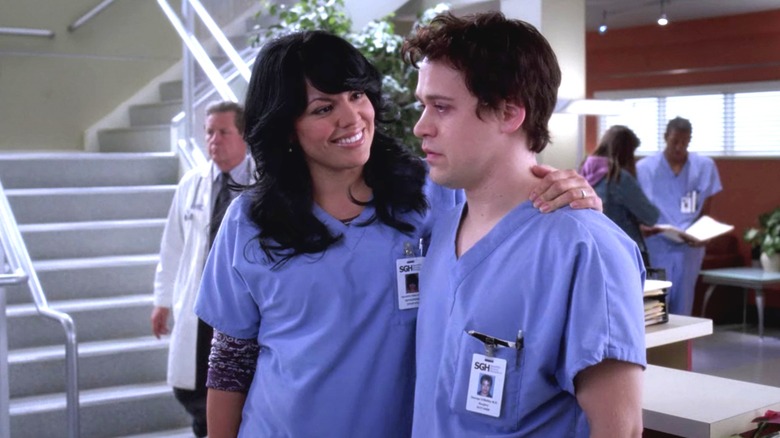 Callie smiling at exhausted-looking George