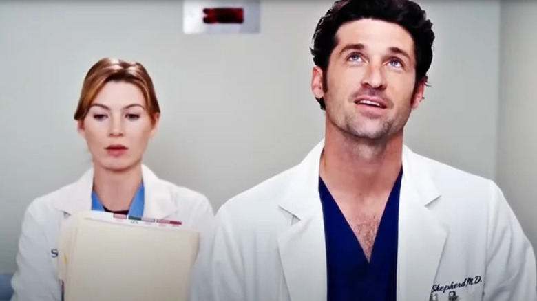 Meredith Grey and Derek Shepherd standing on elevator