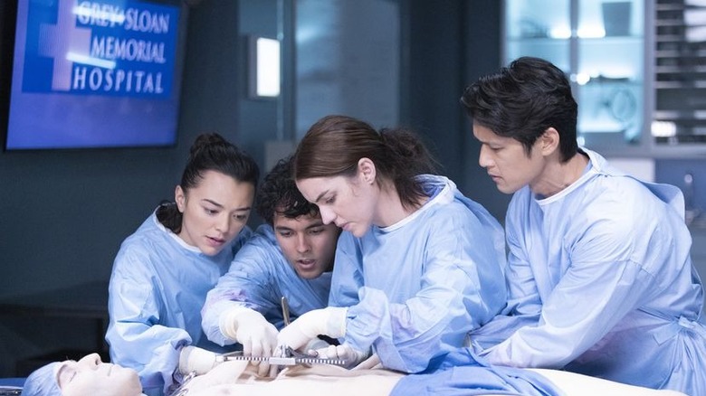Harry Shum Jr and interns in scrubs 