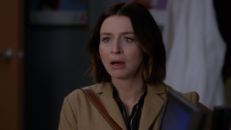 Amelia looks forward, shocked