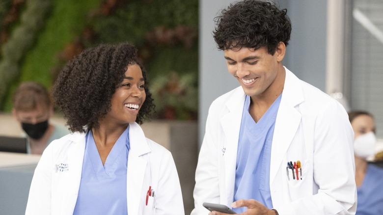 Simone and Lucas laughing doctor coats