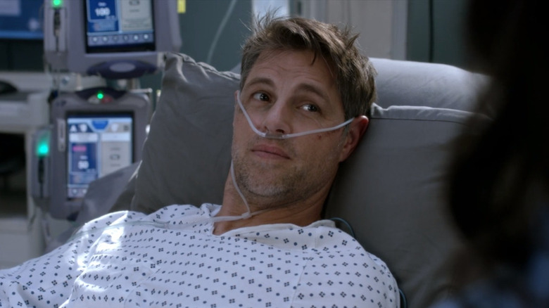 Sam Page lying in hospital bed