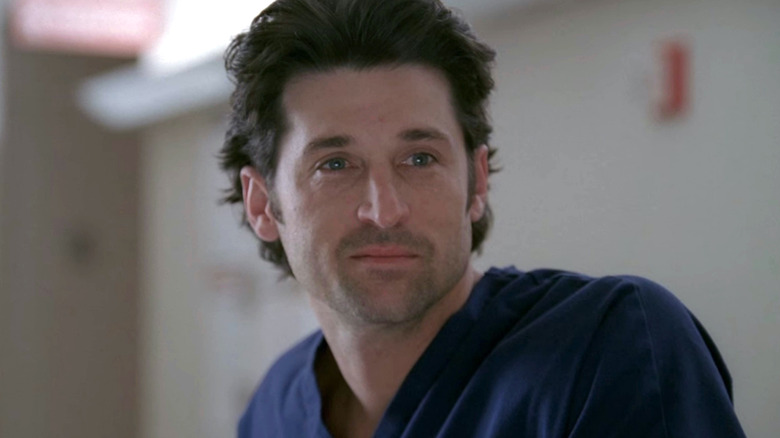 Derek Shepherd wearing blue scrubs