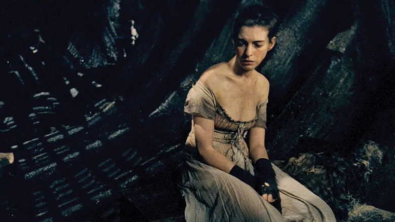 Fantine sits in a sewer in "Les Miserables" (2012)