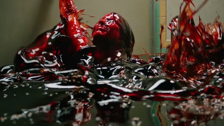 Beverly nearly drowns in a blood in "It: Chapter Two" (2019)