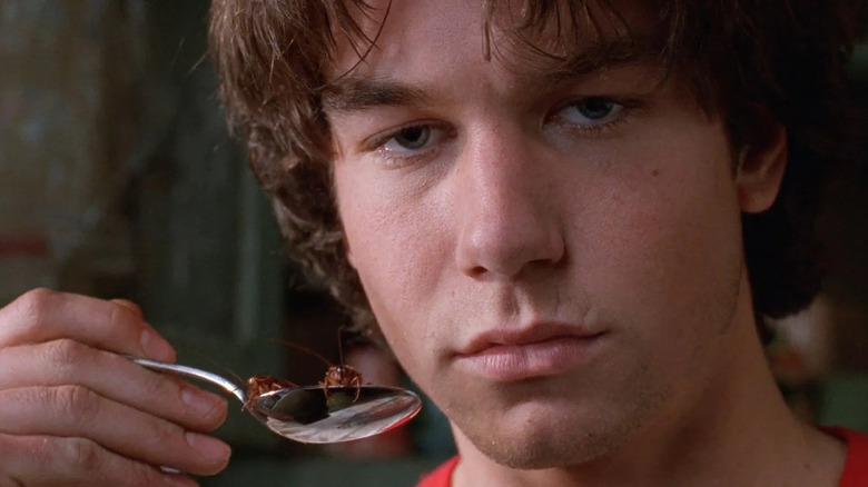 Joe lifts a spoon filled with cockroaches in "Joe's Apartment" (1996)