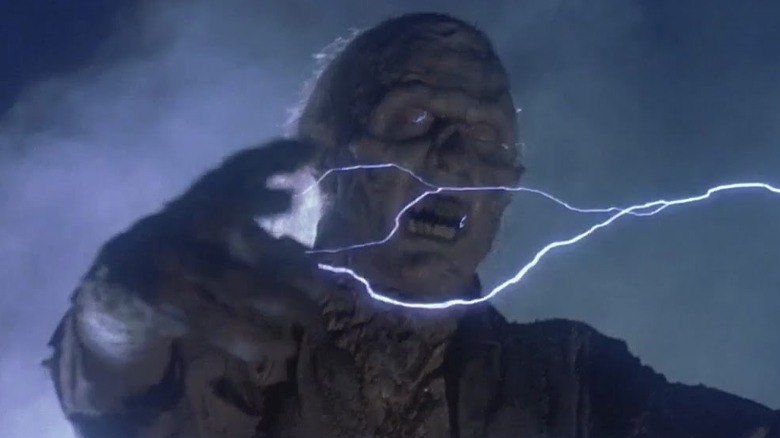 A monstrously deformed Charlie screams while shooting lightning from his fingers in "Prison" (1987)