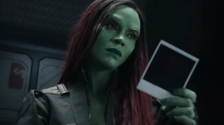 Gamora looking at photograph