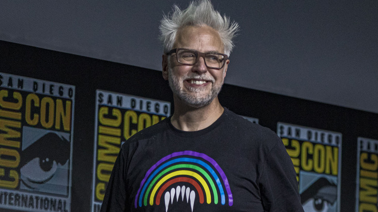James Gunn smiling on Comic-Con stage