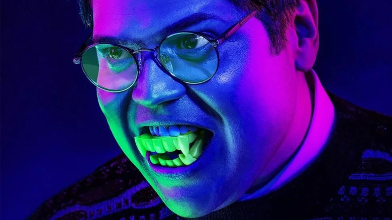 Guillermo wears fake fangs