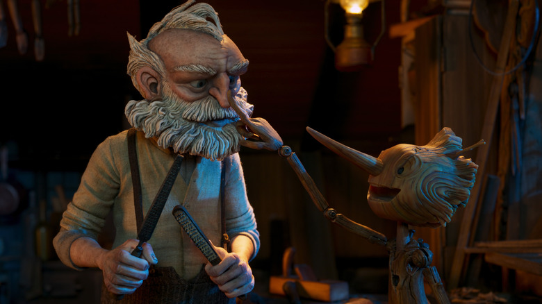 Gepetto and Pinocchio look at each other