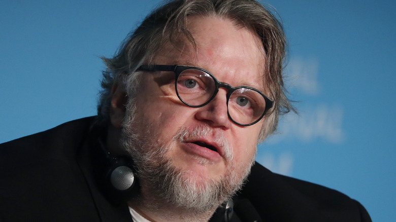 Guillermo del Toro wearing headphones 