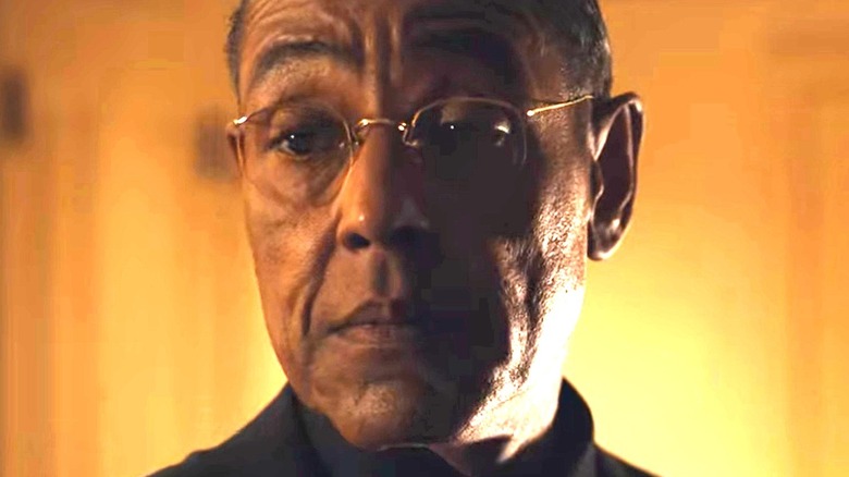 Giancarlo Esposito in front of orange background