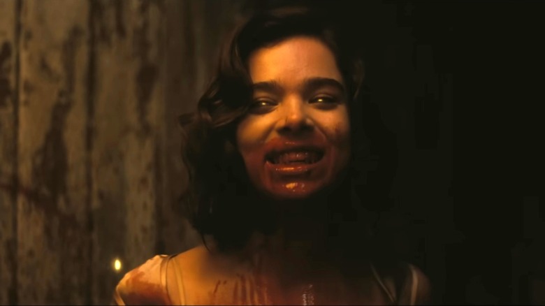 Mary the vampire grins with blood on her face in Sinners