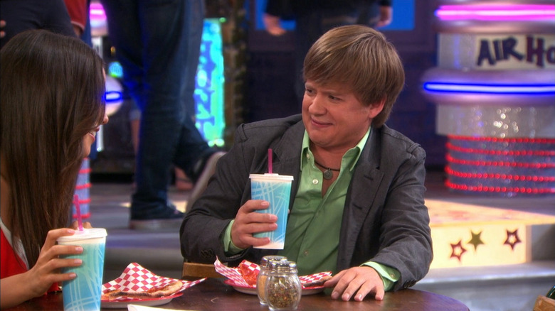 Jackson Stewart holding a drink on Hannah Montana